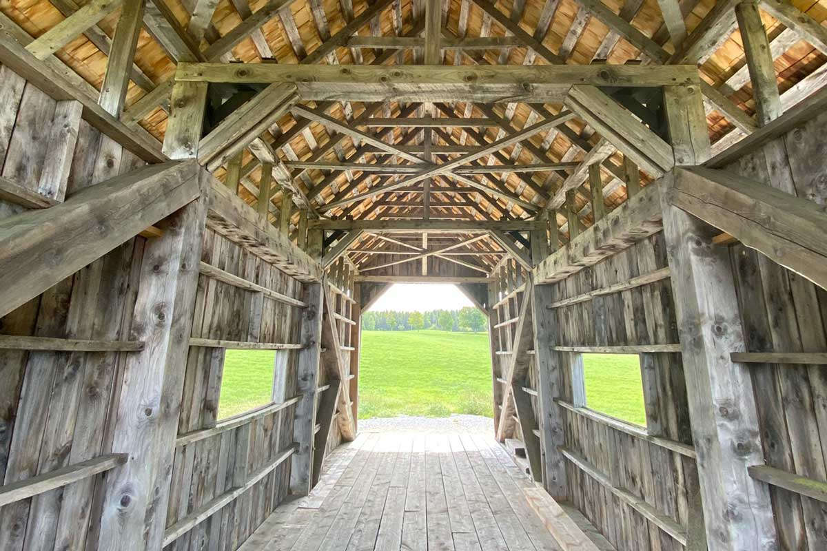 dark barn interior looking to brightness outside