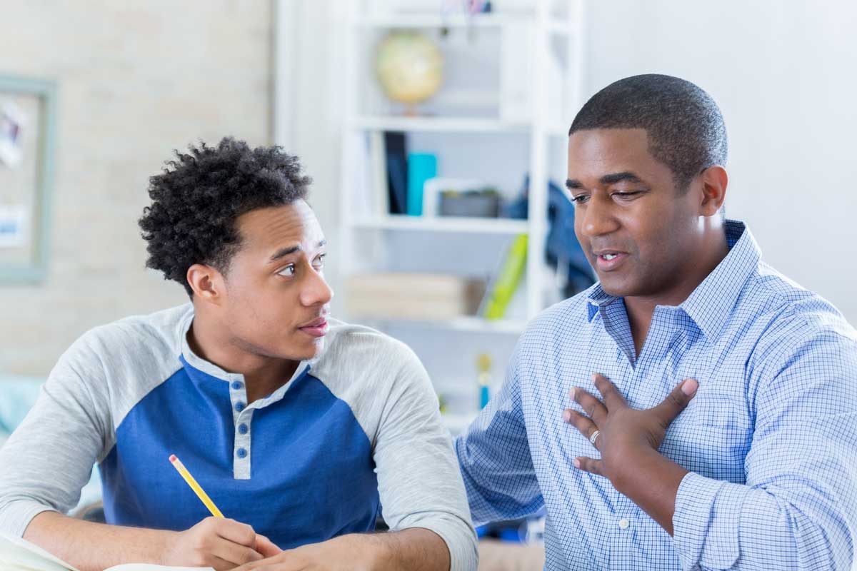 Father and son in serious conversation