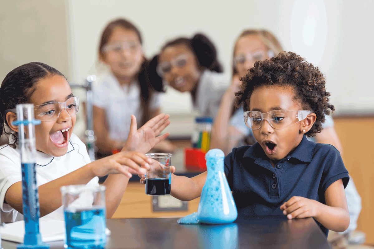 young girls of color do a science experiment