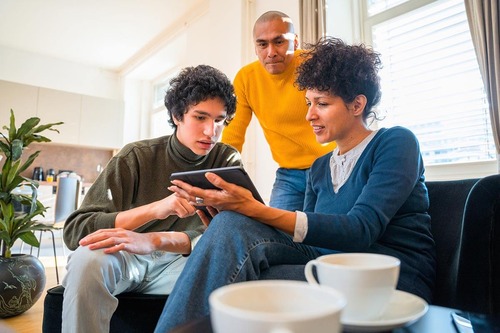 two people sharing tablet