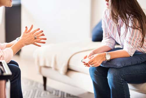 two people sitting discussion