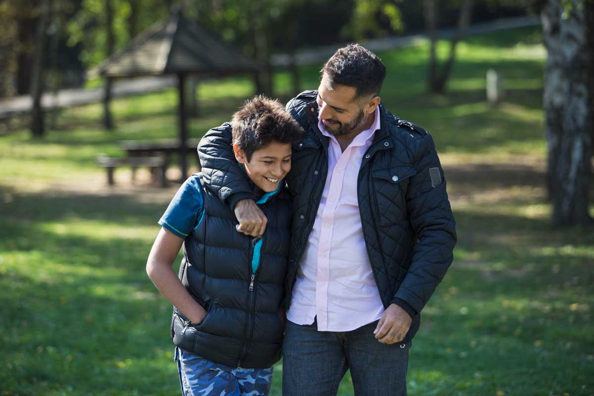 Father and son in conversation.